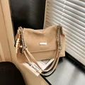 Vintage beige underarm bag with marble texture, chain strap and wooden bead charm - Khaki