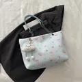 Light blue floral bucket bag with rose print and cute plush cloud charm accessory - With Pendant / Blue