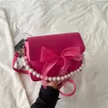 Sac bandoulière magenta chic avec nœud en organza et élégante poignée en perles - Rouge Rose