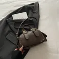 Retro dark brown leather Boston handbag with gold rivets and adjustable strap - Coffee