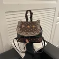 Mini floral patchwork backpack in black and polka dot with ruffle trim details - Brown