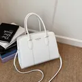 White croc-effect tote bag with top handles and adjustable strap for daily commute - White
