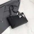 Black lychee leather tote bag with white stitching and heart-pattern silk scarf handle - Black