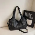 Retro black faux leather dumpling bag with silver zippers and adjustable shoulder strap - Black