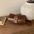 Vintage brown leather shoulder bag with a large gold buckle for women's daily fashion - Brown