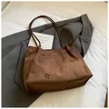 Close-up of brown suede tote bag featuring laser-cut floral hollow patterns and soft texture - Coffee without Pendant