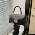 Crossbody bag in black leather and grey tweed with a golden M-logo clasp detail - Black