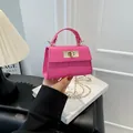 Mini hot pink square handbag with crocodile pattern, top handle and gold chain strap - Deep Pink