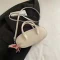 Minimalist cream-colored oval baguette bag in PU leather with adjustable strap - White Without Pendant