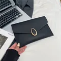 Elegant black Saffiano leather envelope clutch bag with oval gold clasp for women - Black