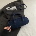 Navy blue baguette bag with leopard pattern, features a handheld handle and shoulder strap - Blue Without Charm