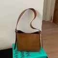 Retro brown suede underarm bag with adjustable leather strap and a trapezoid structure - Brown