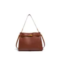 Close-up of caramel brown woven leather texture and bronze metal lock buckle on the tote - Mocha Brown