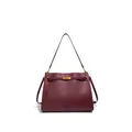 Close-up of wine red woven leather tote showing intricate texture and gold clasp - Burgundy