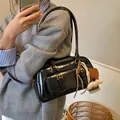 Vintage black patent leather shoulder bag with gold hardware and heart charms - With Charm / Black