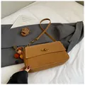 Minimalist brown square flap bag with gold oval twist lock and white contrast stitching - Brown with Pendant