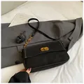 Black matte shoulder bag with gold twist lock and stylish white contrast stitching - Black without Pendant