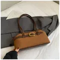 Detail of retro brown suede shoulder bag with gold buckle and smooth leather trim - No Pendant / Brown