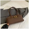 Detail of matte brown faux leather shoulder bag featuring vintage gold buckle and strap - No Pendant / Brown