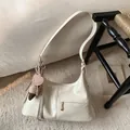 Chic cream white pleated tote bag with heart pendant and fringe detail on soft carpet - No Pendant / White