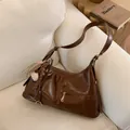Brown faux leather tote bag with tassel charm and vintage glossy finish - No Pendant / Brown