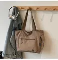 Khaki canvas tote bag with multi-pocket design and adjustable shoulder straps - Khaki