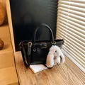 Black vintage leather bucket bag with gold buckle detail and a cute rabbit pendant - No Pendant / Black