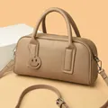 Beige Boston bag in pebbled leather with top handles and smiley face charm pendant - Khaki