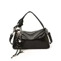 Glossy black vintage hobo bag with top handle and decorative charm on white background - With Pendant / Black