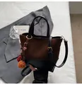 Brown and black contrast suede crossbody bag with decorative fur ball charm - Coffee With Pendant