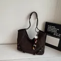 Dark brown matte leather tote bag with stylish decorative charms and adjustable straps - With Charm / Coffee