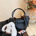 Minimalist black pebble leather bucket bag with plush rabbit charm and gold-tone hardware - Basic Style (No Pendant) / Black