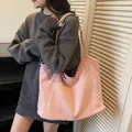 Pink faux suede large hobo tote bag for women featuring a minimalist slouchy design - Pink