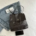 Minimalist vintage dark brown PU leather backpack with metallic swivel lock and slim straps - Coffee No Charm