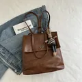 Vintage brown leather tote bag with metal buckle and decorative rabbit plush charm - Brown with Pendant