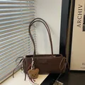 Brown faux suede underarm bag with decorative side bows and fluffy bear charm - With Pendant / Brown