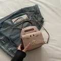 Mini corduroy backpack with cat ears and chain strap on blue denim jacket - Khaki