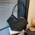 Classic tweed tote bag in black and gold finish with elegant leather shoulder straps - Black
