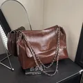 Dark brown tote bag in wrinkled leather with silver chain and FASHION BAGS text - Brown