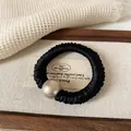 Coletero elegante de satén plisado negro con gran perla champán para el cabello - Coletero de Perlas Negro
