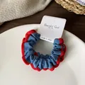 Blue denim scrunchie with red lace trim on white card for ponytail hair styling - Light Blue Red Striped
