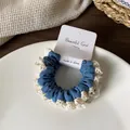 Navy blue lace-trimmed scrunchie with crochet edge on a white display card - Light Blue Lace