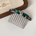Elegant tortoiseshell acetate hair comb with golden metal teeth in a blue marble finish - Emerald Green Oval Hair Comb