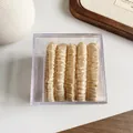 Five pieces of champagne gold satin scrunchies set in a transparent square gift box - Beige