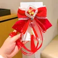 Red velvet New Year hair bow clip with golden zodiac horse charm and long red tassels - Happy Pony