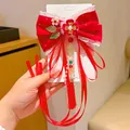 Girls red velvet bow hair clip with pearls and long tassels in Chinese style - Auspicious Floral