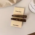 Lot de barrettes à cheveux en acétate motif écaille de tortue marron sur carte - Rayé Café