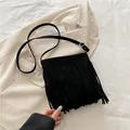 Retro black faux suede crossbody bag with fringe detail and adjustable shoulder strap - Black