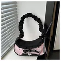 Detailed view of pink textured tote bag with black bow embroidery and heart charm - Pink and Black Bow Ruched Style (Style 3)