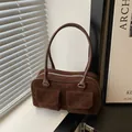 Deep brown suede baguette bag with vintage pockets and silver hardware detailing - Brown